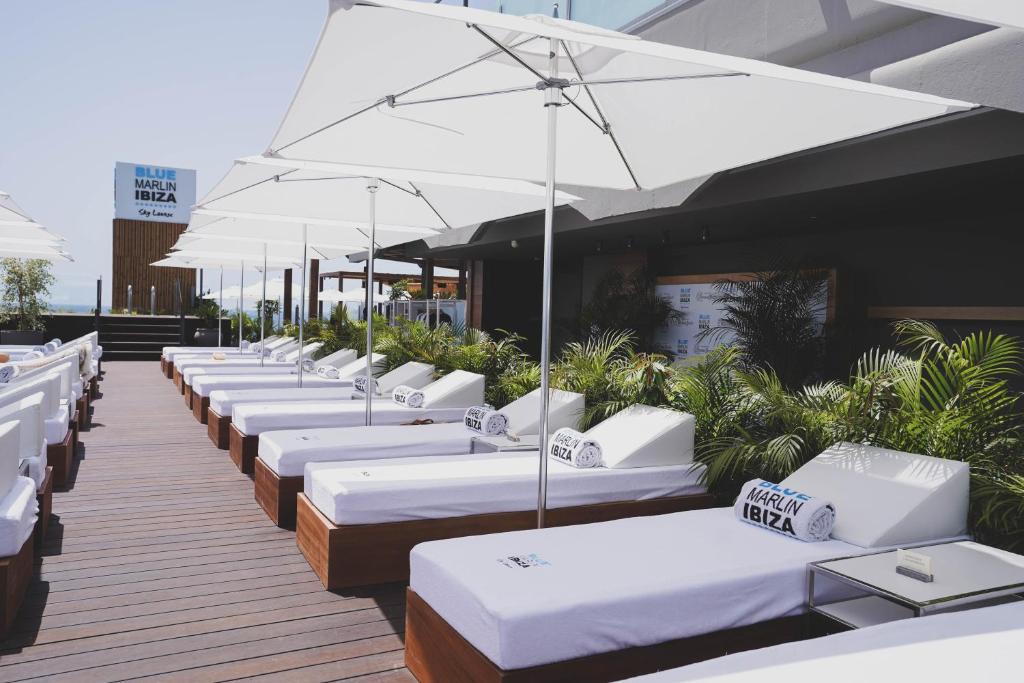 Hotel Faro, a Lopesan Collection Hotel – Ligbedden onder parasols, Meloneras